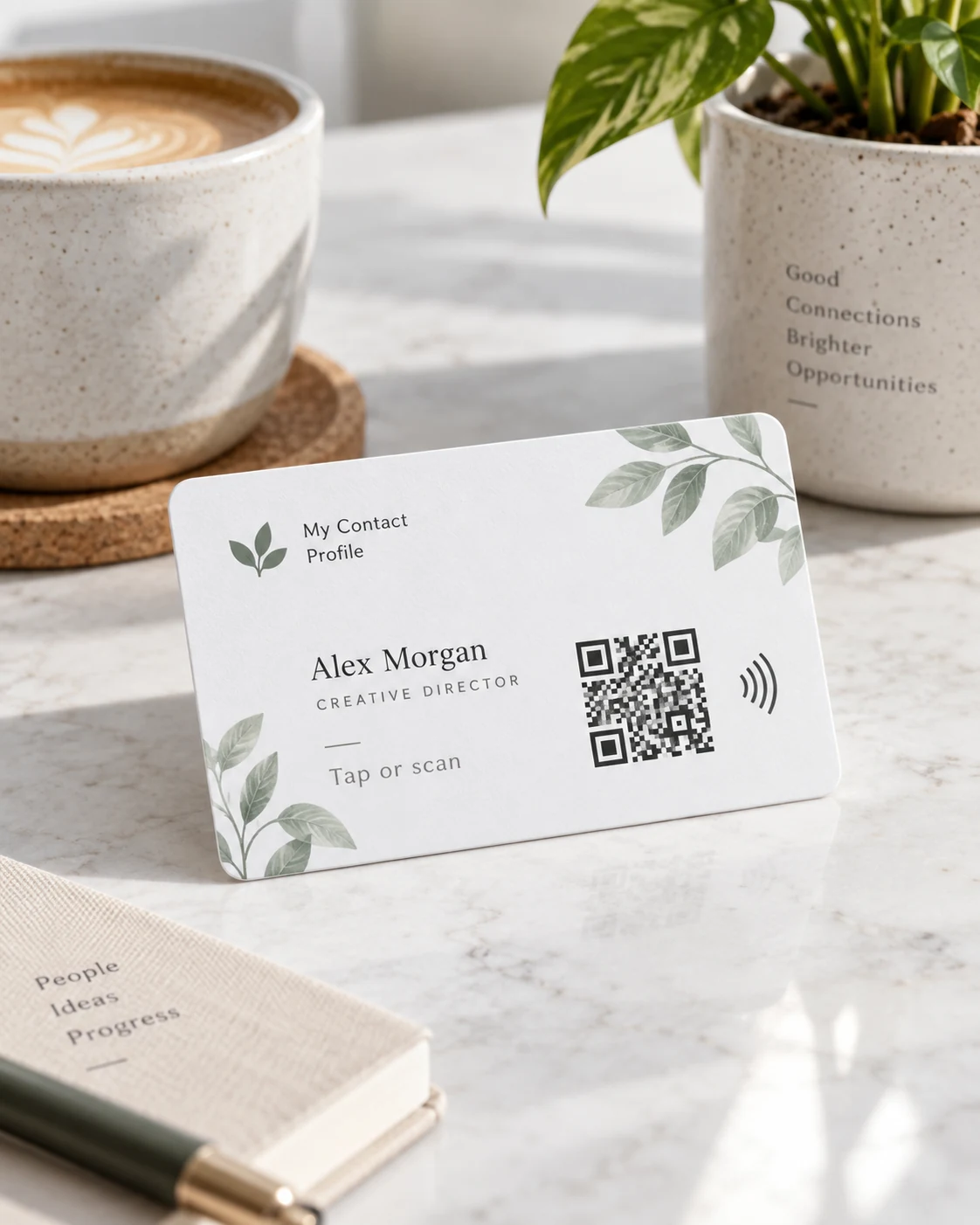 Minimal contact card and phone on a desk